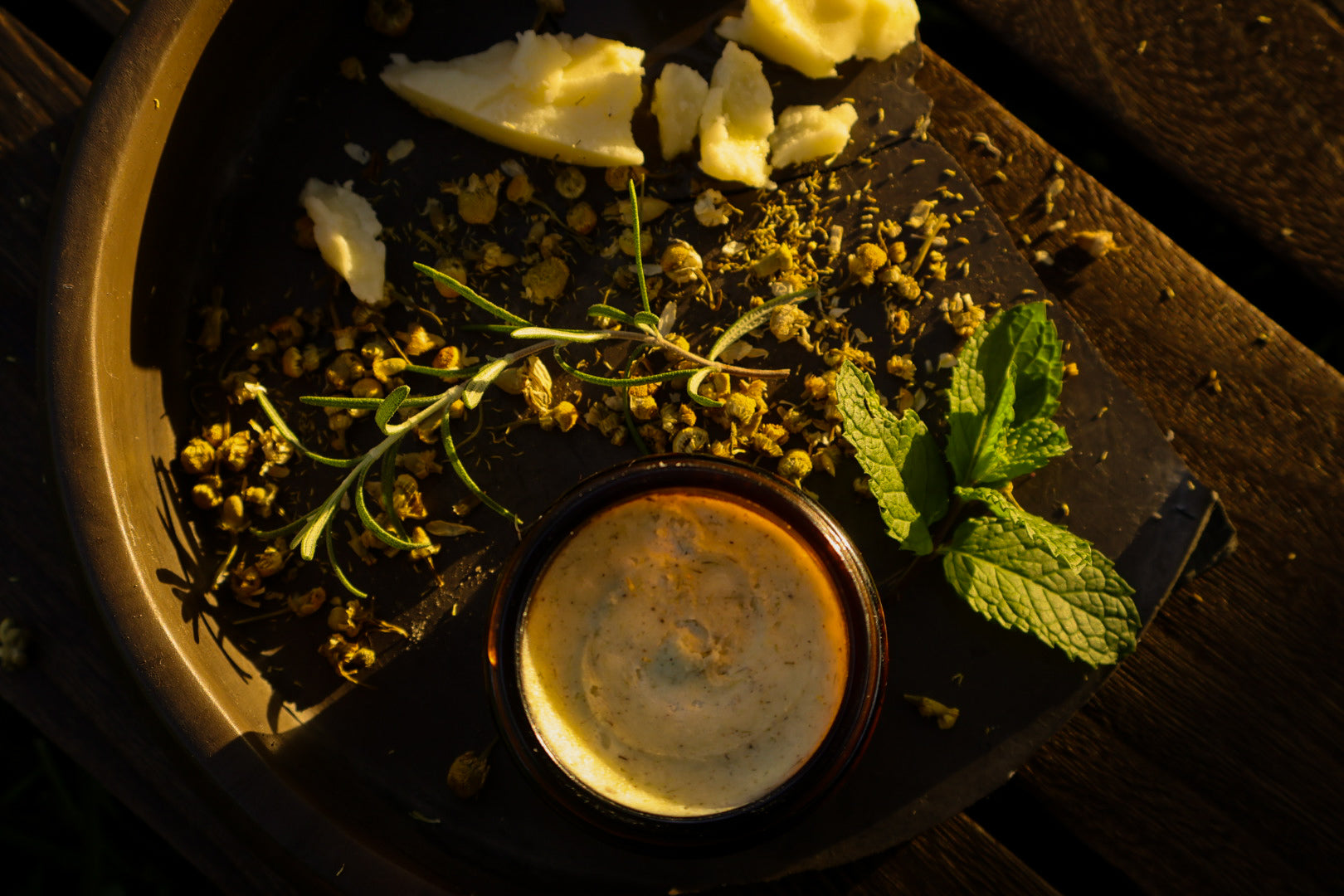 Morning in The Hollow Whipped Tallow Balm with rosemary, mint, sage and chamomile herbs in golden light