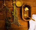 Front Porch Remedy whipped tallow balm with dried herbs and wooden spoon flatlay