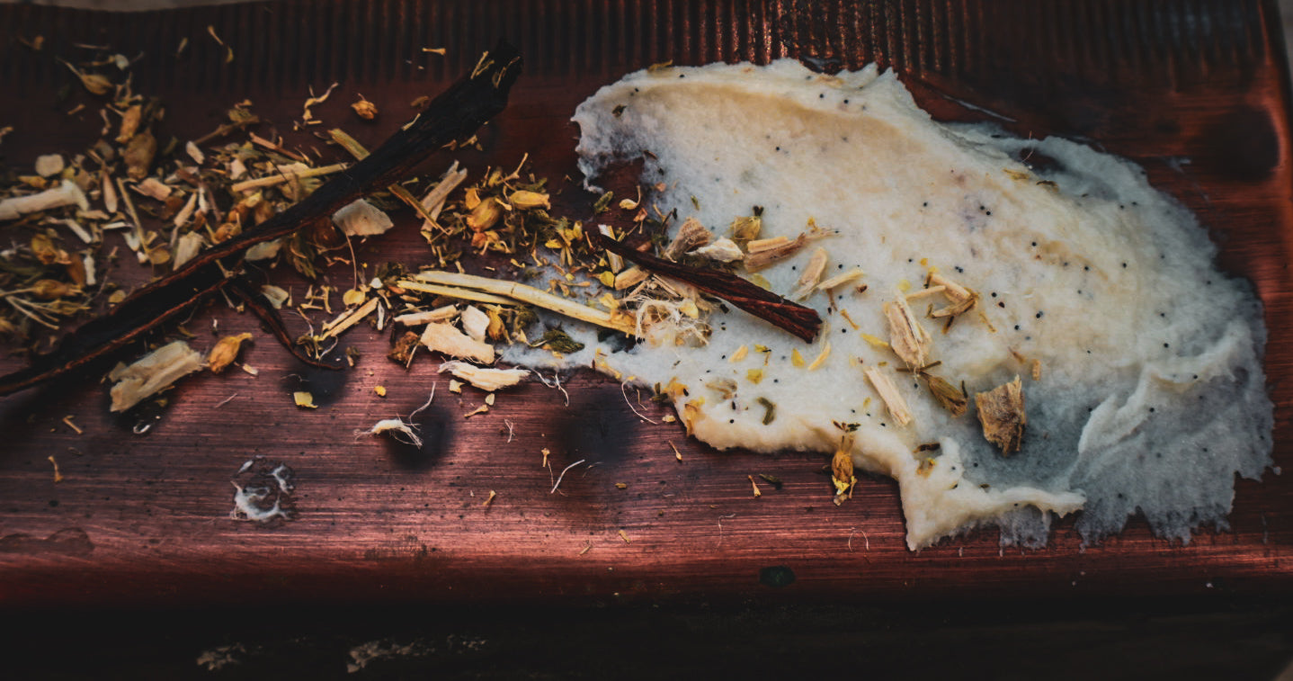 The Gentle Guardian whipped tallow balm — raw tallow with yarrow, marshmallow root and vanilla botanicals on wood
