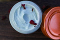 Copper Moon tallow cream open jar with rose petals, overhead view