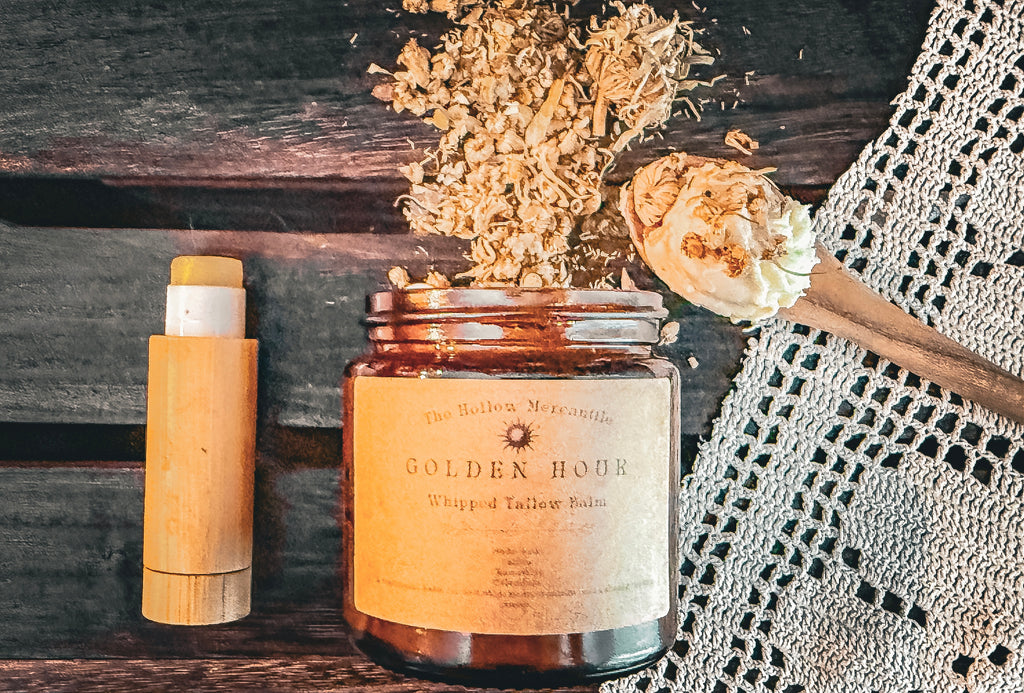 Golden Hour collection — salve stick beside whipped tallow balm jar with dried botanicals